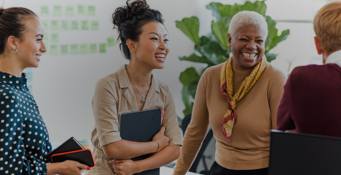 Colleagues smiling in meeting