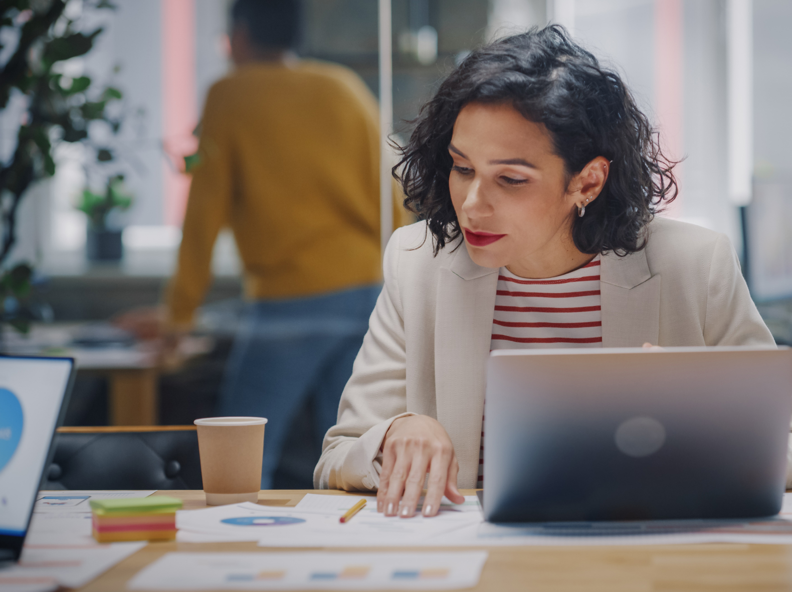 Female professional reviewing financial data)
